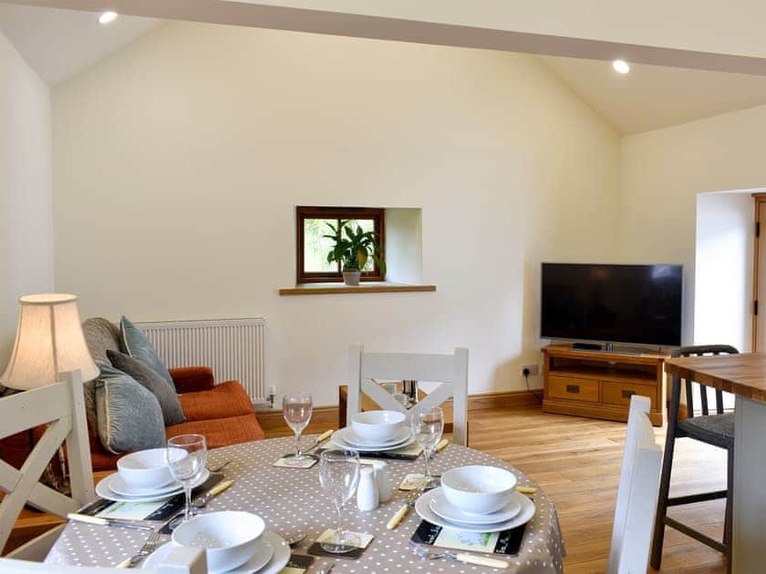 Open plan living space with wooden floor | Lake View Farm, Watermillock, near Penrith