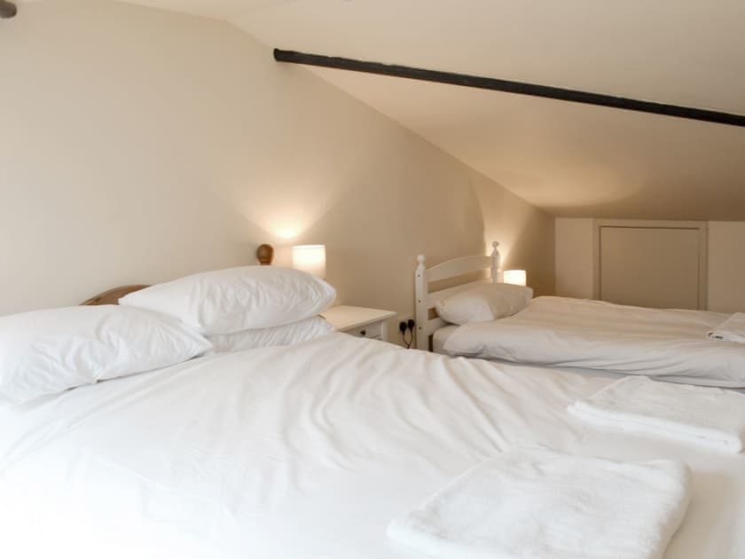 Family bedroom with single and double beds | Louisa’s Cottage, Priors Dean, near Petersfield