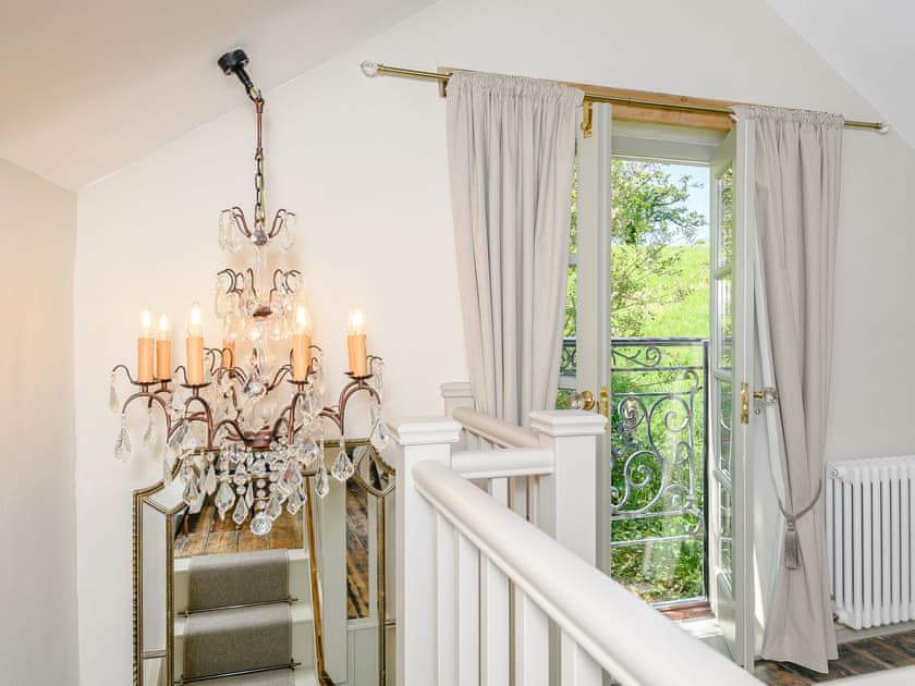 Characterful lighting and Juliette balcony | Mill Cottage, Hawkchurch, near Lyme Regis