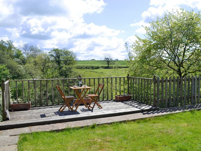 Lawned garden and patio area | Low Floweryhirst Cottage, Roweltown, near Brampton