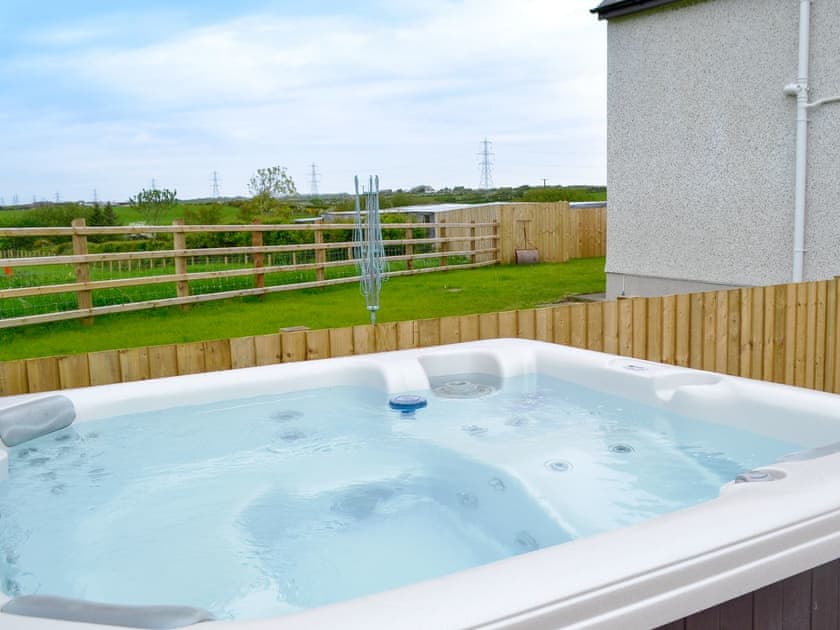 Relaxing hot tub | Rhosydd Cottage, Llandyfrydog, near Amlwch