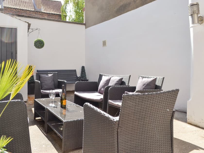 Enclosed courtyard with outdoor furniture | Belfrey House, York