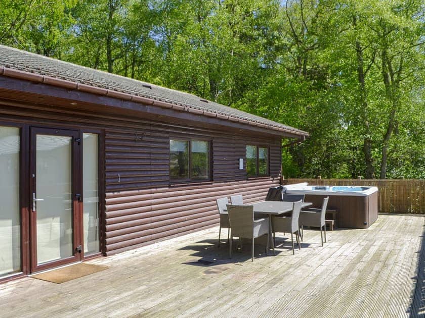 Decking with hot tub and sitting out area | Leafy Run - Otterburn Hall Lodges, Otterburn, near Bellingham