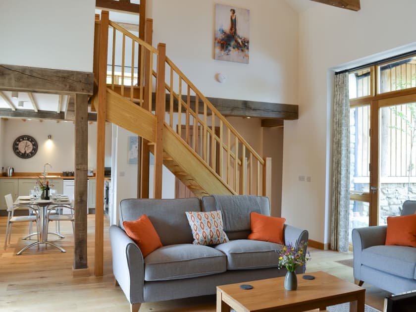Characterful living area with exposed wood frame and beams | The Horse Gin - Higher Blagrove Farm Cottages, East Worlington, near South Molton