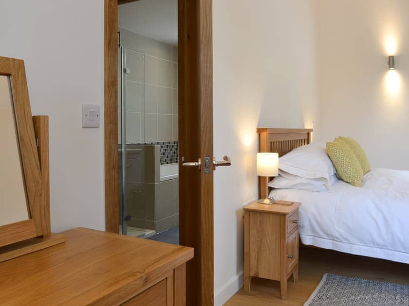 Semi-circular spacious ground floor kingsize bedroom  | The Horse Gin - Higher Blagrove Farm Cottages, East Worlington, near South Molton