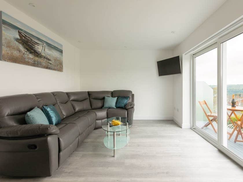 Spacious living room with sliding door to balcony | Grandview Dartmouth, Dartmouth