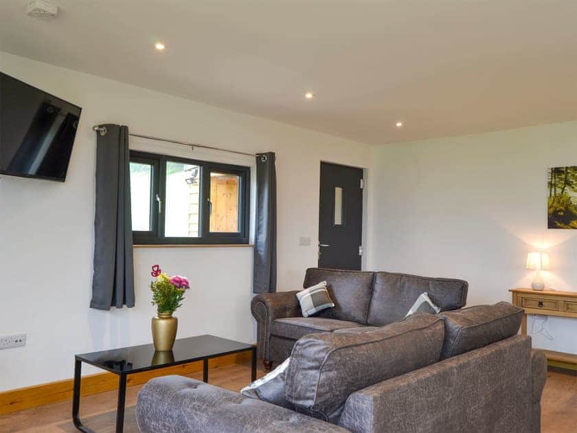 Living area with wood burner | Offa’s Dyke Lodge - Acre Luxury Lodges, Stanner, near Kington