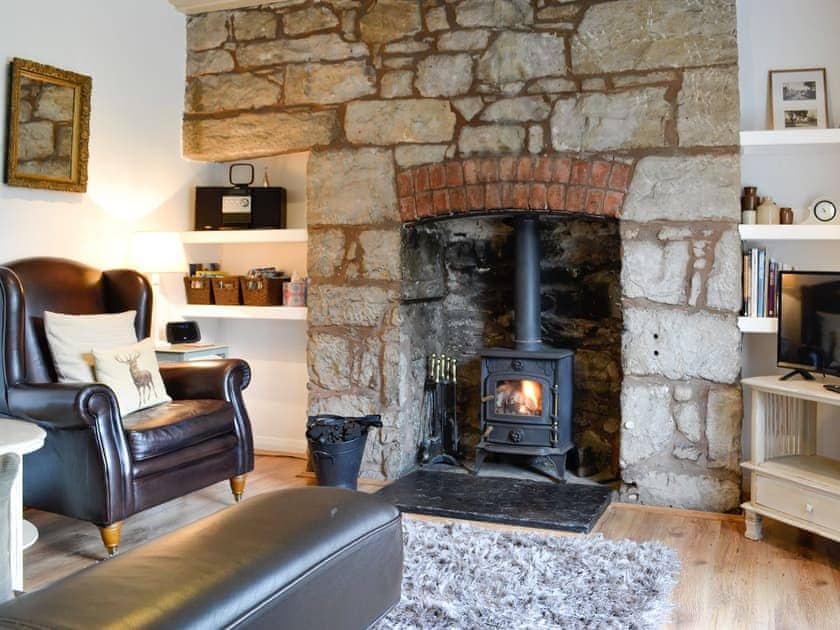 Cosy living room with feature fireplace | The Bellringers Cottage, Llandegla, near Llangollen