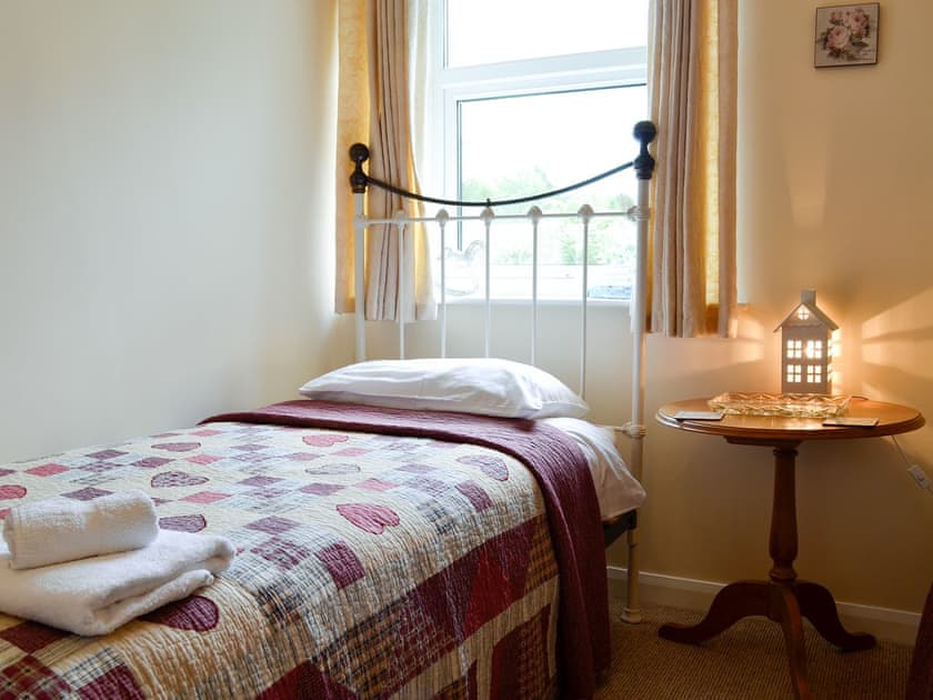 Twin bedroom with antique style single beds | The Bellringers Cottage, Llandegla, near Llangollen