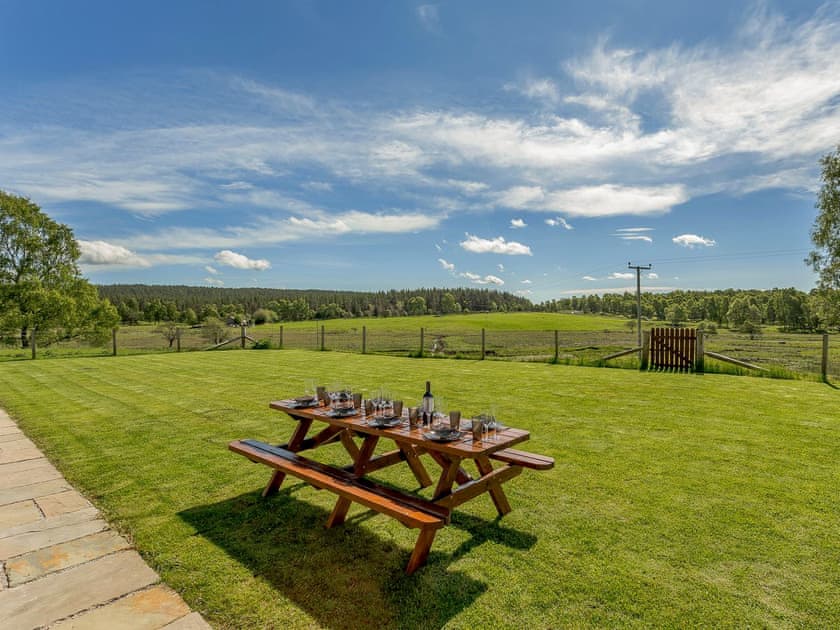 Large lawned garden with stunning views | Sunnyside House, Carrbridge, near Aviemore