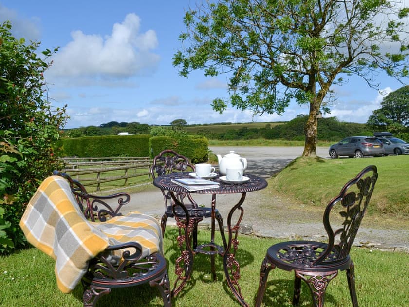 Outdoor furniture on the lawned garden area | Willow Cottage, Woolfardisworthy, near Bideford