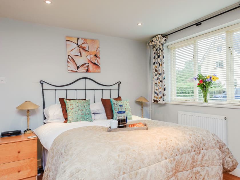 Romantic bedroom with antique style double bed | Coachman’s Cottage - Yaxley Manor Cottages, Yaxley near Eye