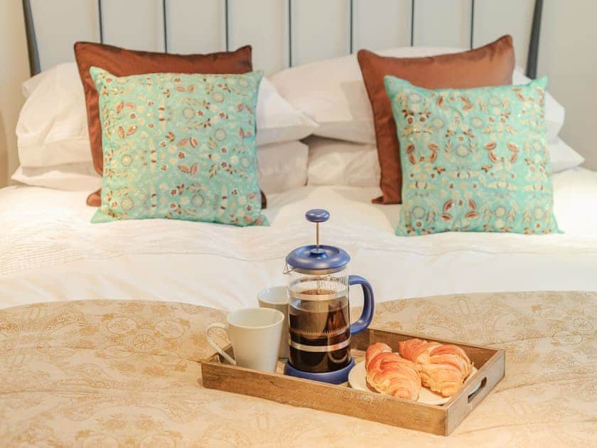 The bedroom makes an ideal place in which to take a leisurely breakfast | Coachman’s Cottage - Yaxley Manor Cottages, Yaxley near Eye