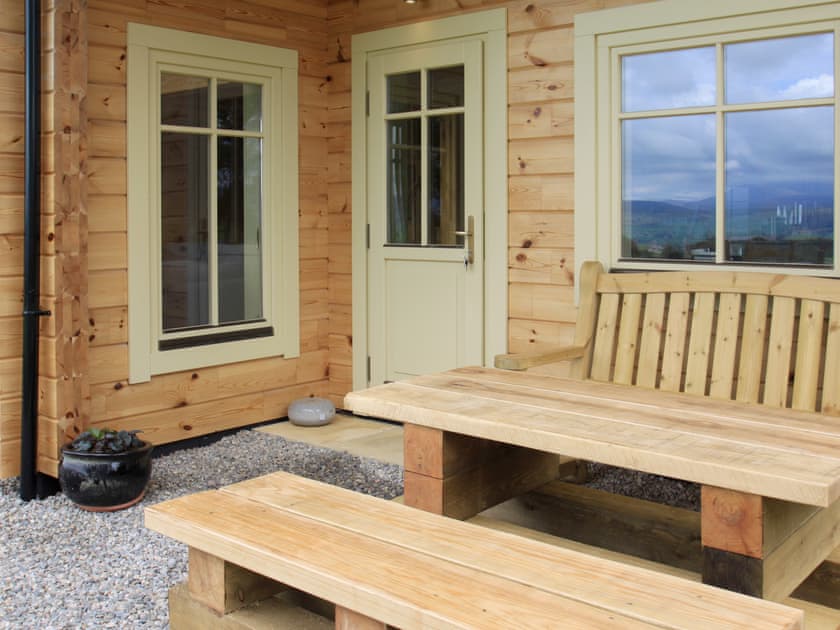 Outdoor furniture at the main entrance | Moonshine Cottage, Culbokie, near Dingwall