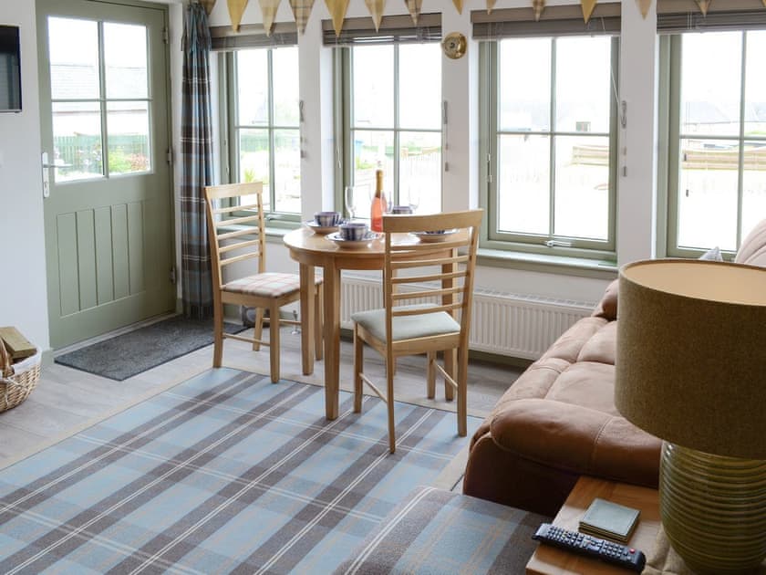 Convenient dining area within living room | Sunset Cottage, Portmahomack, near Tain