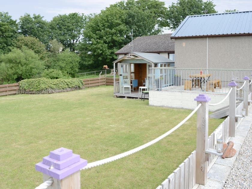 Well-maintained garden with summerhouse | Sunset Cottage, Portmahomack, near Tain