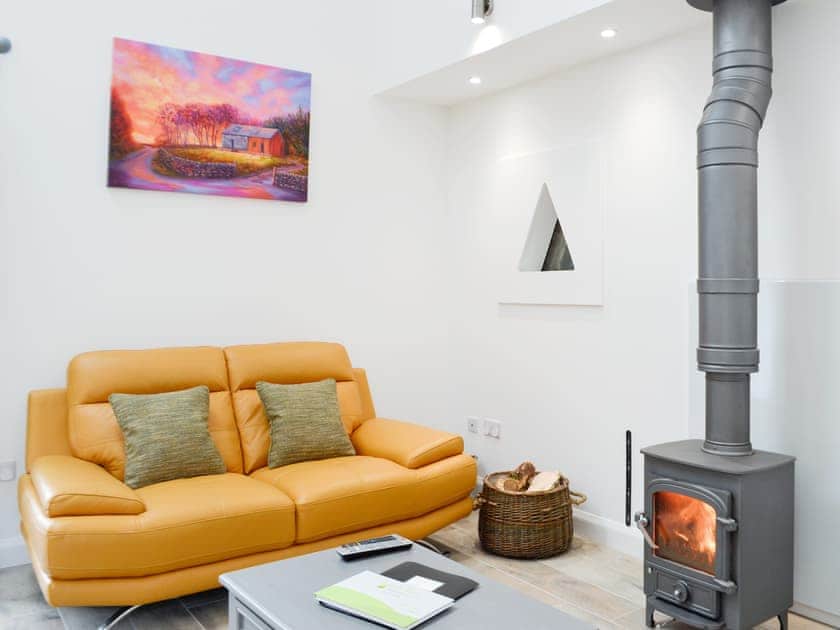 Warming wood burner within the living room | Ramerish Retreat, Laurieston, near Gatehouse of Fleet