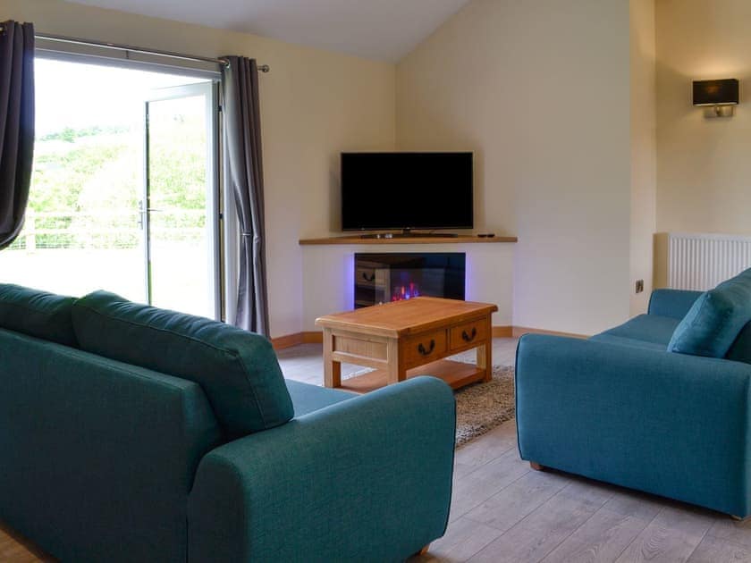 Living room | River Lodge - Bryncoch Holidays, Hundred House, near Builth Wells