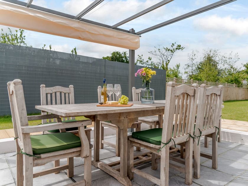 Relaxing patio area | Rosedene, Colwell Bay, near Yarmouth