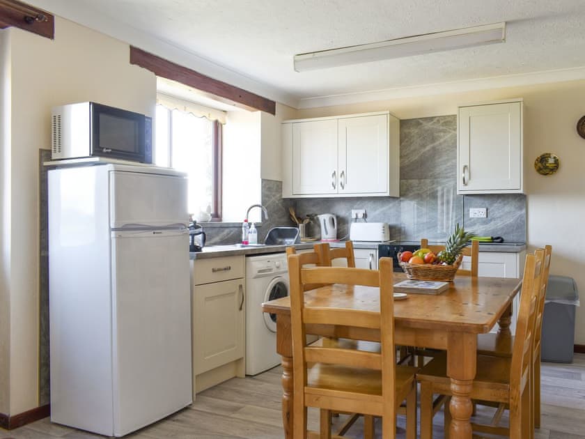 Fully appointed kitchen with convenient dining area | Haywain - Trentinney Farm Holiday Cottages, St Endellion, near Port Isaac