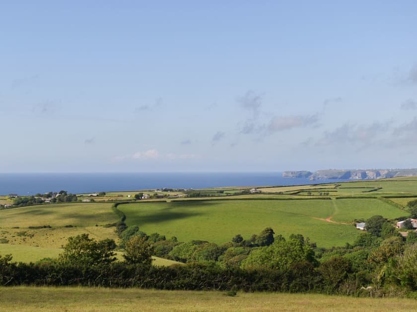 Views to the coast from the grounds | Owl’s Roost - Trentinney Farm Holiday Cottages, St Endellion, near Port Isaac
