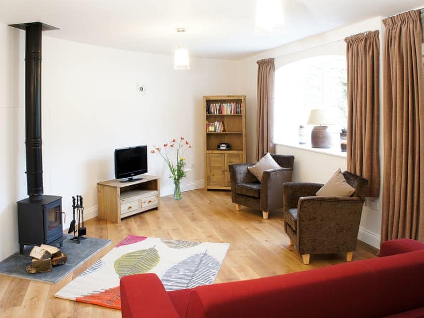 Delightful living area with wood burner | Swansfield Stables, Alnwick