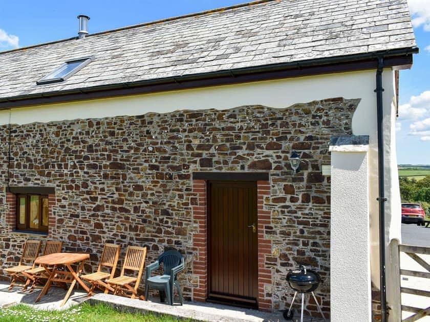 Patio with garden furniture and BBQ | Cider Cottage - Well Farm Holiday Cottages, Holsworthy, near Launceston