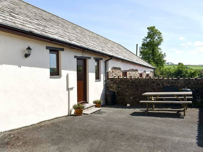 Front courtyard | Millers Rest - Well Farm Holiday Cottages, Holsworthy, near Launceston
