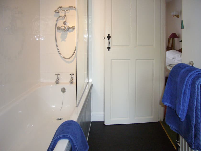 Modest bathroom with shower over the bath | The Clark’s Cottage, Kirkby Lonsdale
