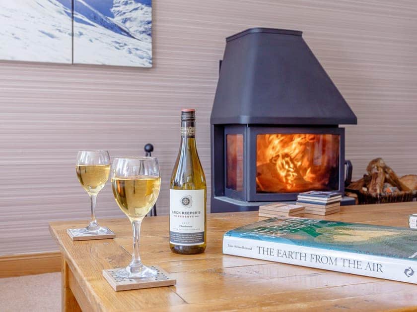 Comfortable living room with wood burner | The Lookout, Aviemore