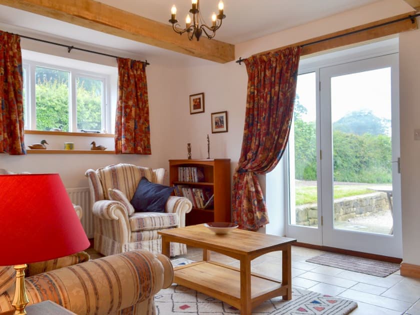 Comfy living room with patio doors  | Holly Cottage, Handley, near Matlock