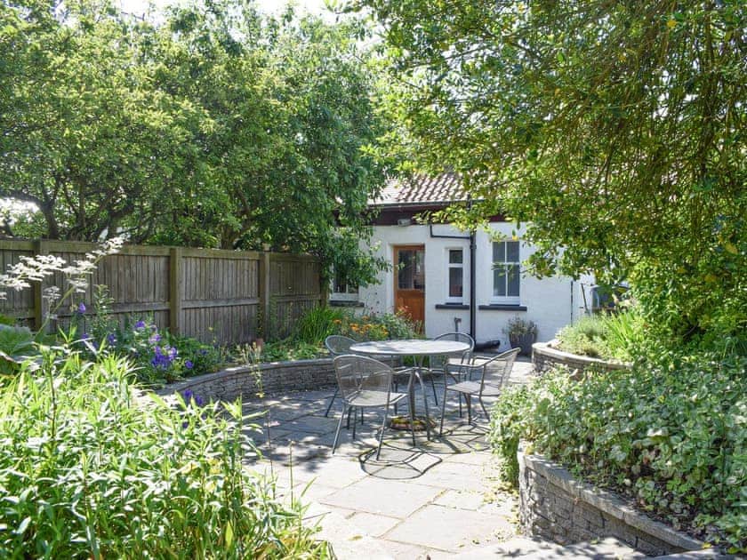Attractive patio and garden | Kirkview Cottage, Upper Largo, near Leven