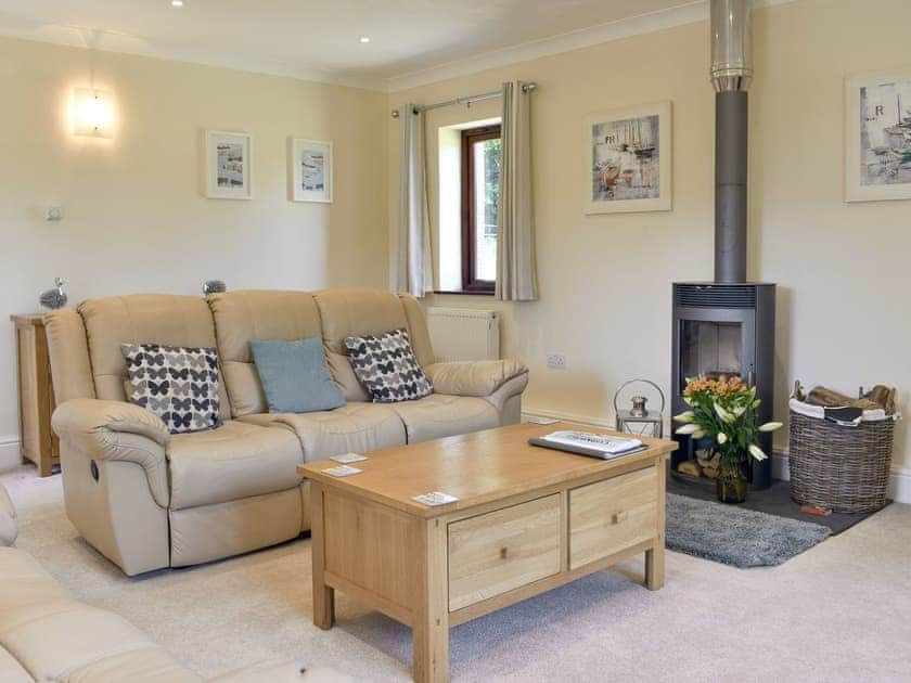 Delightful living room with wood burner | The Oaks - Trecan Farm Cottages, Lanreath, near Looe