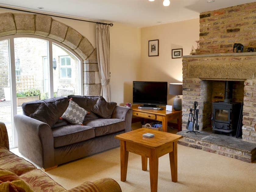 Relaxing lounge/dining room with multi-fuel stove | The Steadings, Denwick near Alnwick