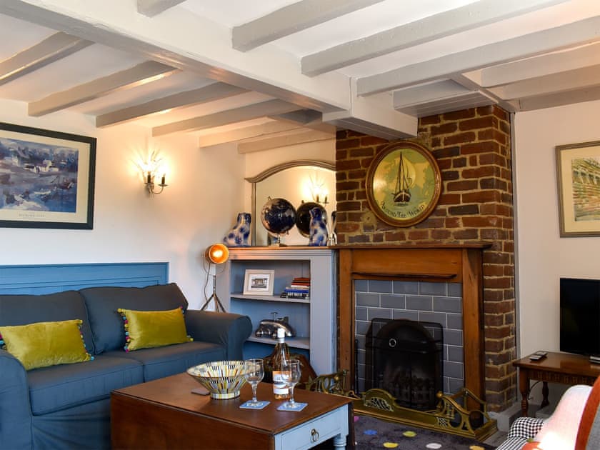 Characterful living room with feature fireplace  | Raspberry Cottage, Ripple, near Deal