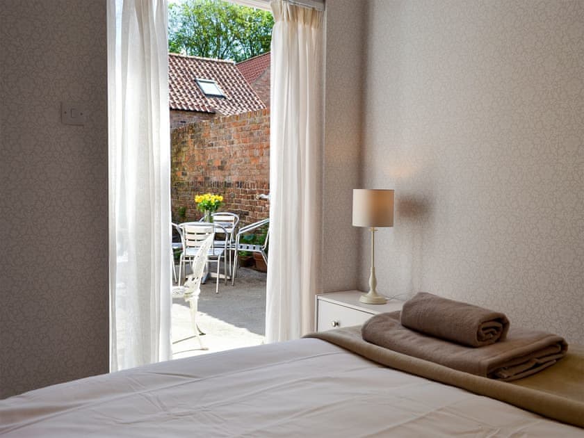 French doors leading to patio | Oxtoby’s Downstairs - Oxtoby’s Cottages York, York