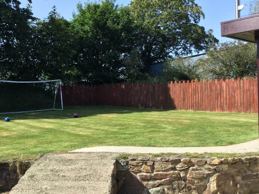 Enclosed lawned garden area | The Old Coach House - Hayscastle Cottages, Hayscastle