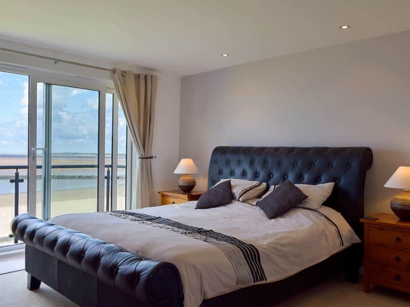 Terrific bedroom with super kingsize bed and sea views | Seaview, Llanelli