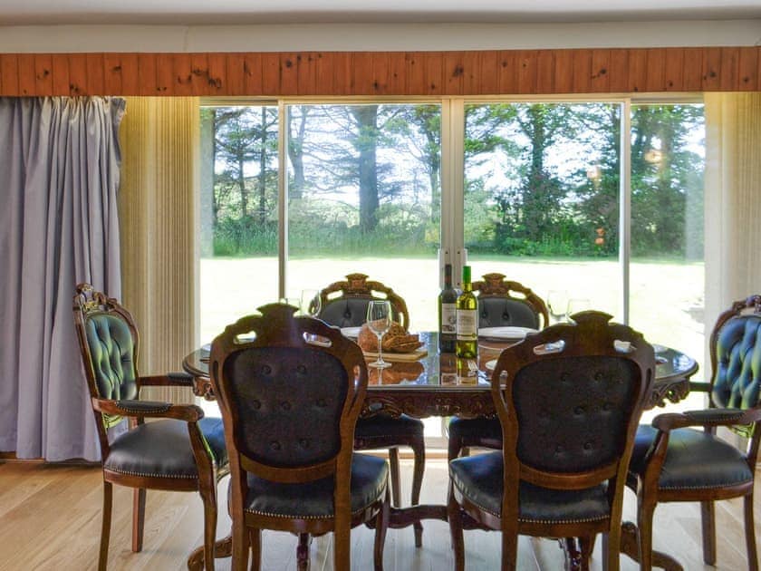 Dining area with patio door to garden | The Old School House, Portpatrick, near Stranraer