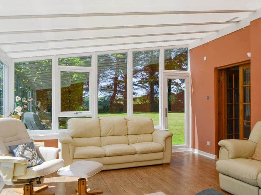 Spacious living area within the conservatory | The Old School House, Portpatrick, near Stranraer
