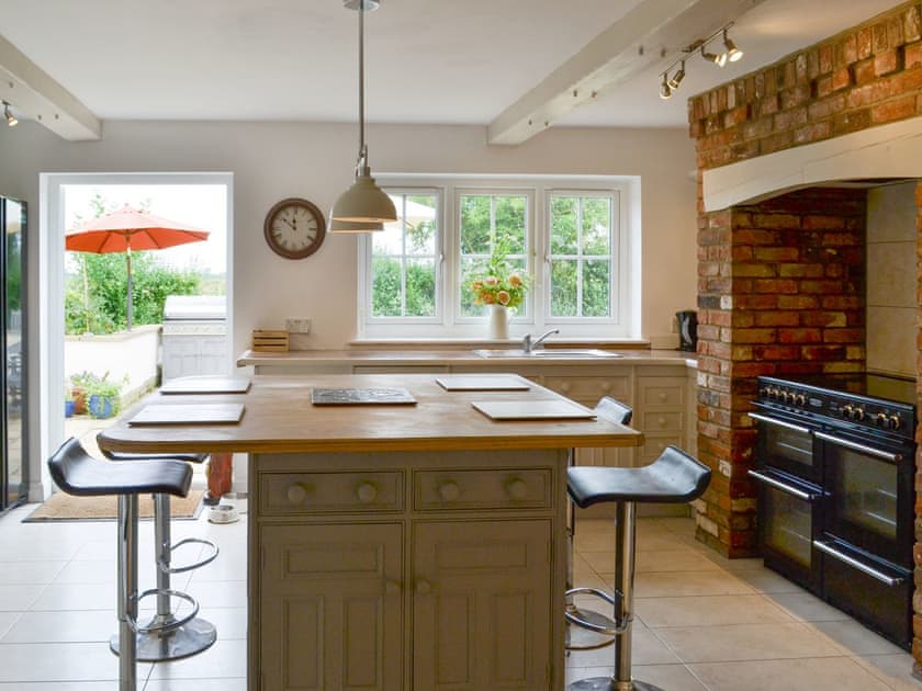 Fully appointed kitchen with dining ’island’ | Walnut Tree House, Tilney St Lawrence, near Kings Lynn