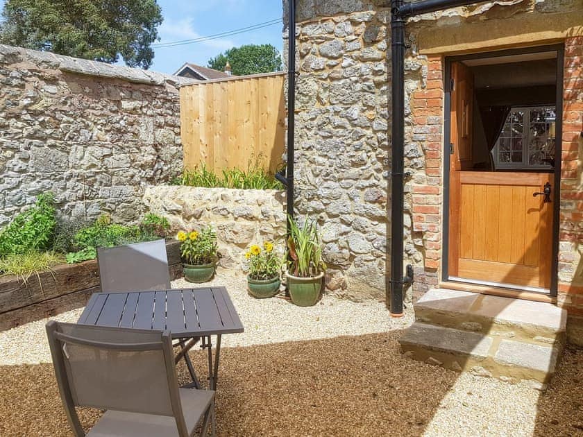 Secluded garden with furniture | Farm Cottage - Kingates Farm, Whitwell, near Ventnor