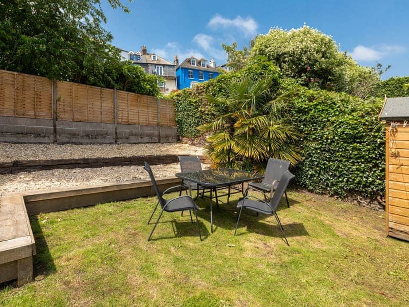 Garden area with outdoor furniture | Evelyn Cottage, Dartmouth