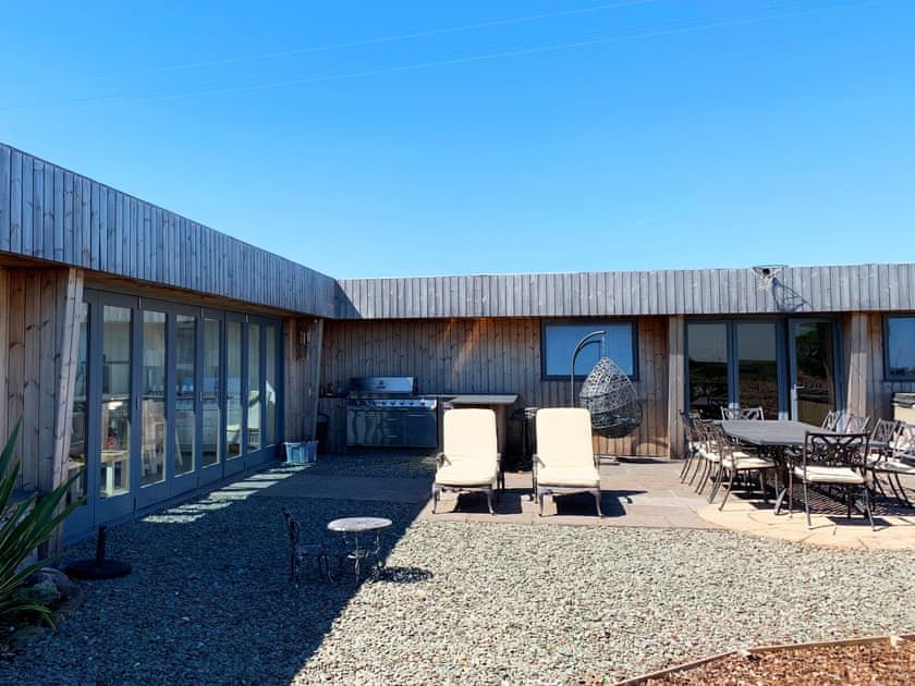 Enclosed courtyard with patio, garden furniture and gas BBQ | Meadow View, Stainton with Adgarley, near Dalton-in-Funess