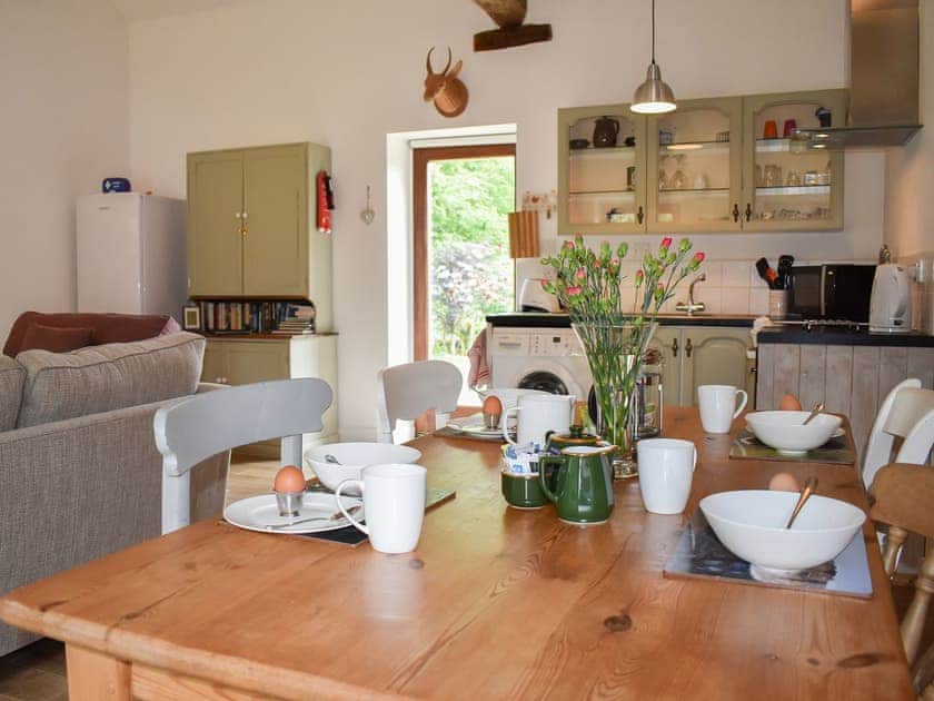 Exposed wood beams above open plan living area | Crossbill Cottage, Chopgate near Stokesley