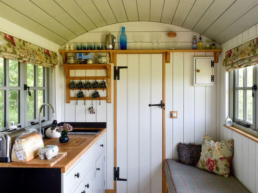Kitchen and lounge area with wood burner | Romney Hut, Jacob Hut - Tilbury Farm, West Bagborough, near Taunton