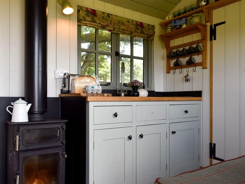 Kitchen and lounge area with wood burner | Romney Hut, Jacob Hut - Tilbury Farm, West Bagborough, near Taunton