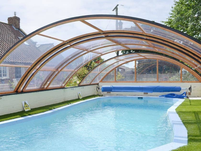Shared outdoor pool within garden | The Granary, The Mews - Summertree Farm, near Thornton-le-Dale and Pickering