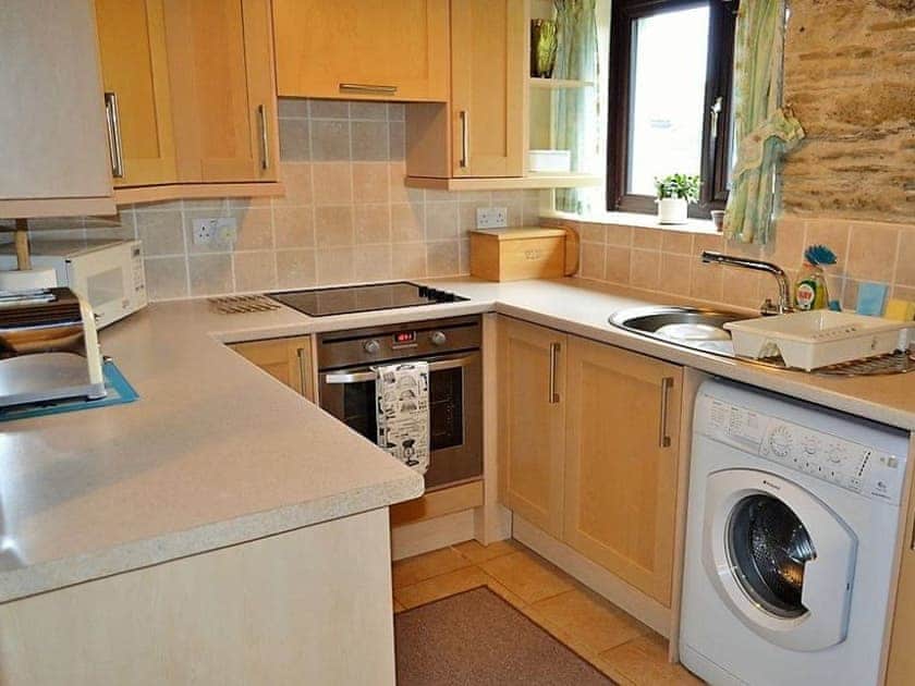Well equipped galley style kitchen | Mill Cottage, Fowey