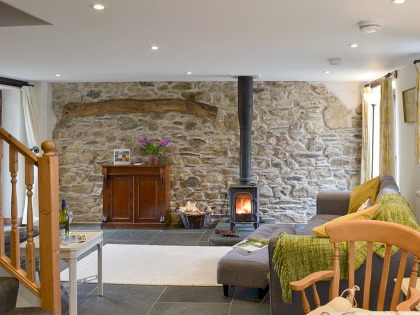 Charming living room with wood burner | Primrose - Lower Millcombe Barns, Linkinhorne, near Callington
